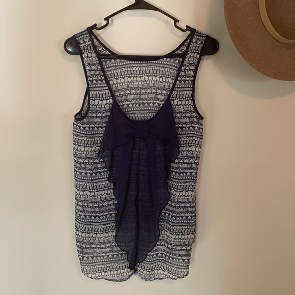 Navy Flowy top with bow in back. - Picture 1 of 3